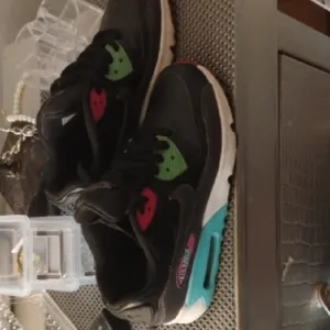 Nike Blue and Black Sneakers with Classic Silhouette