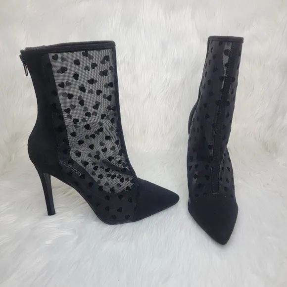 Pointed toe black mesh stiletto heeled ankle boots.