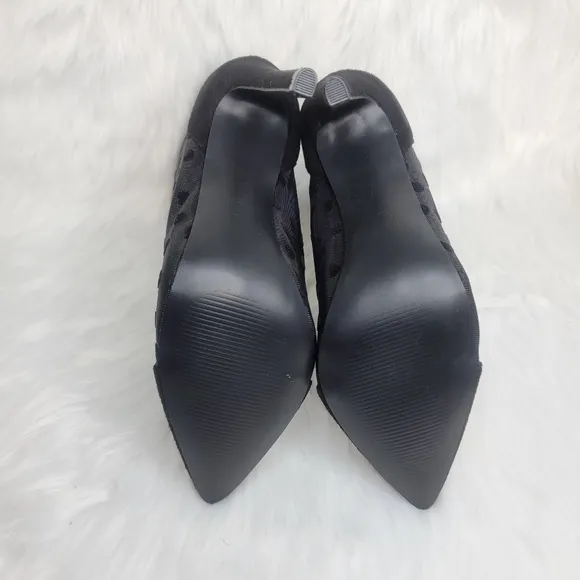Pointed toe black mesh stiletto heeled ankle boots.