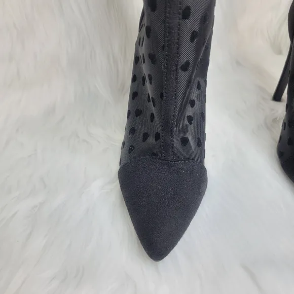 Pointed toe black mesh stiletto heeled ankle boots.