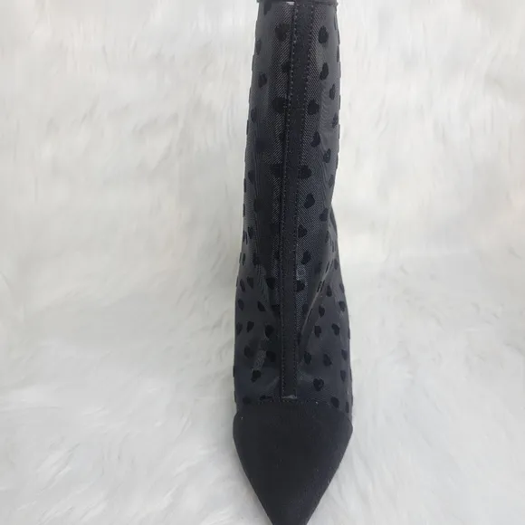 Pointed toe black mesh stiletto heeled ankle boots.