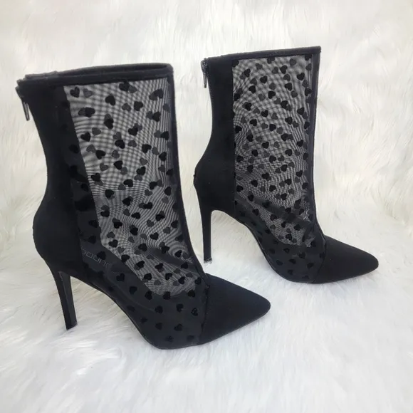 Pointed toe black mesh stiletto heeled ankle boots.