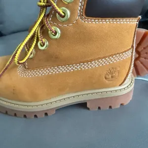 Timberland Tan and Brown Boots with Rugged Construction